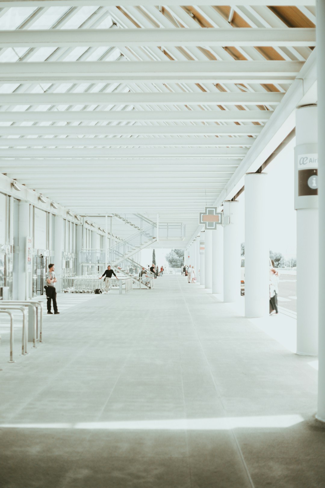 a-man-standing-in-a-large-white-building-ytzsylukpeg